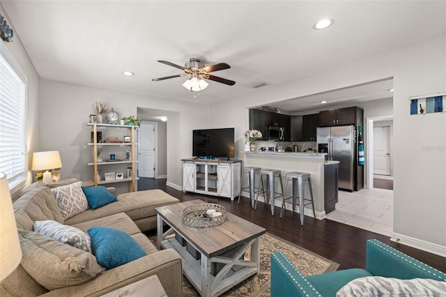 4519 S Grady Ave, Tampa, FL 33611 - living room with a ceiling fan, light wood finished floors, recessed lighting, and baseboards