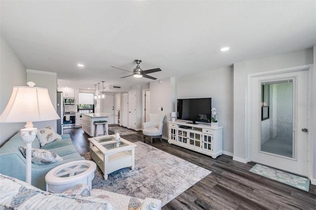 living room featuring dark wood finished floors, baseboards, a ceiling fan, and recessed lighting
