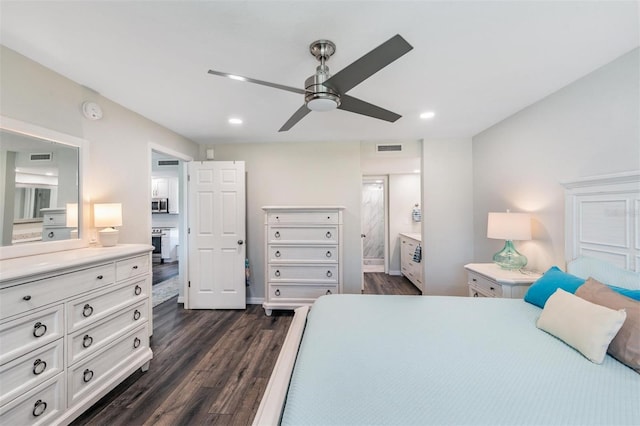bedroom featuring visible vents, dark wood-style floors, recessed lighting, and connected bathroom