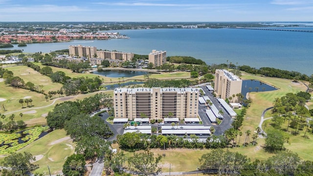 aerial view featuring a water view and golf course view