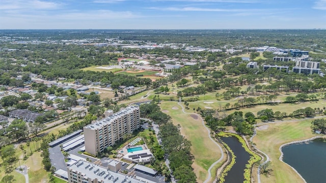 aerial view featuring a water view and view of golf course