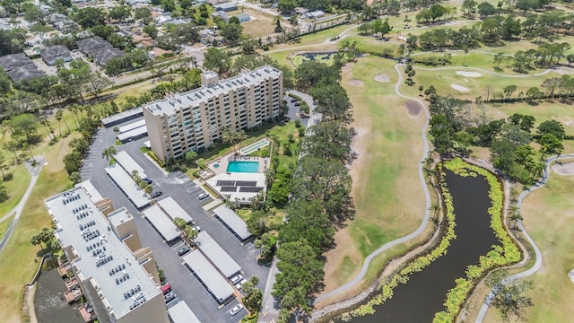 drone / aerial view featuring a water view and golf course view
