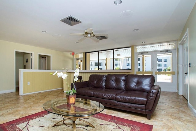living room with french doors, baseboards, visible vents, ceiling fan, and light tile patterned floors