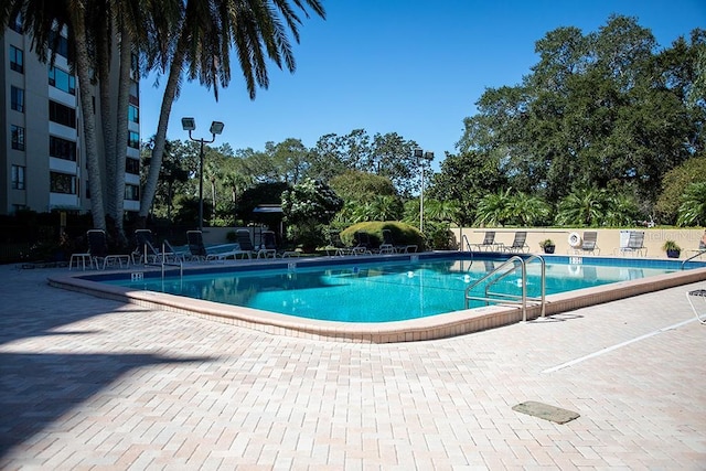 pool featuring a patio area