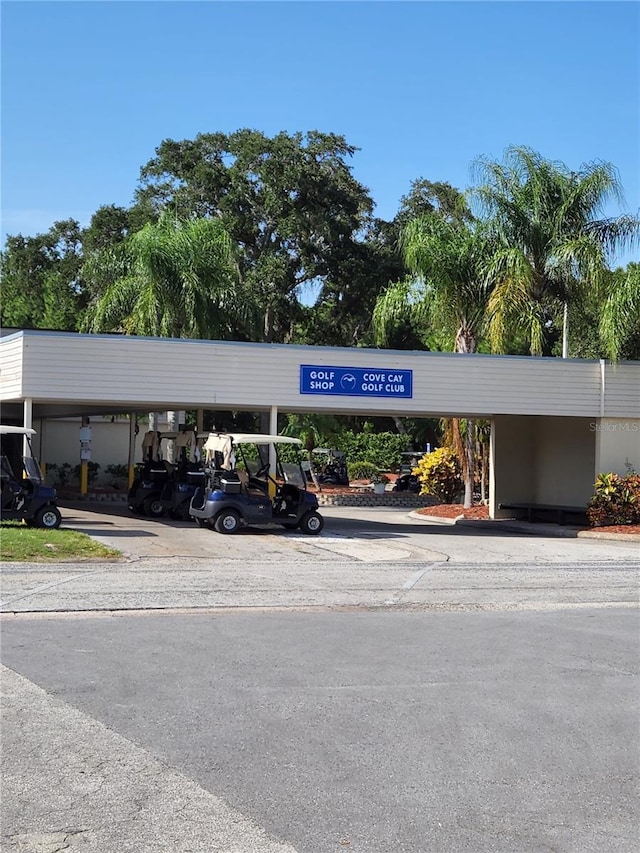 view of parking / parking lot featuring a carport