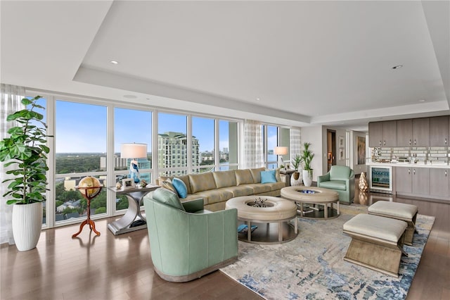 3301 Bayshore Blvd Unit 2401E, Tampa, FL 33629 - living room with wine cooler, a raised ceiling, recessed lighting, and wood finished floors