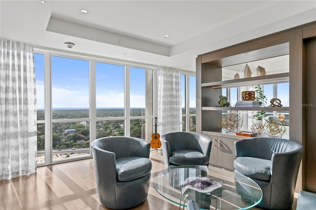3301 Bayshore Blvd Unit 2401E, Tampa, FL 33629 - sitting room featuring a tray ceiling and wood finished floors