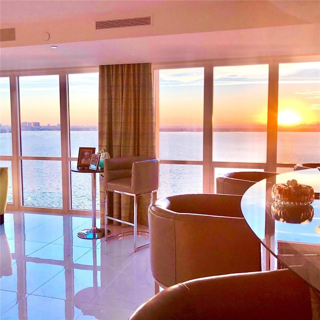 3301 Bayshore Blvd Unit 2401E, Tampa, FL 33629 - dining room with plenty of natural light, a water view, tile patterned flooring, and visible vents