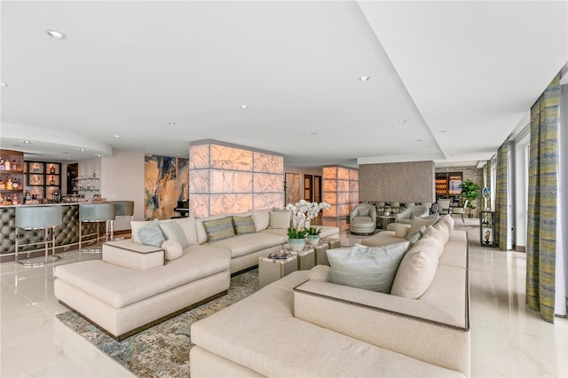 3301 Bayshore Blvd Unit 2401E, Tampa, FL 33629 - living room featuring recessed lighting, marble finish floor, and indoor bar