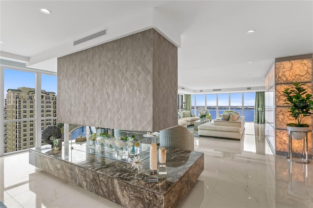 3301 Bayshore Blvd Unit 2401E, Tampa, FL 33629 - corridor featuring a water view, visible vents, recessed lighting, and marble finish floor