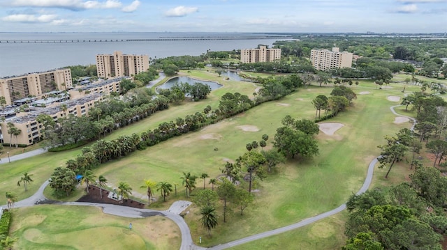 bird's eye view with a water view and golf course view