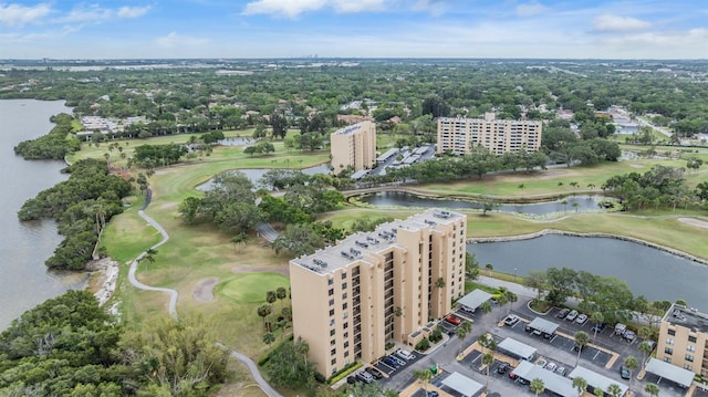 drone / aerial view featuring a water view and golf course view