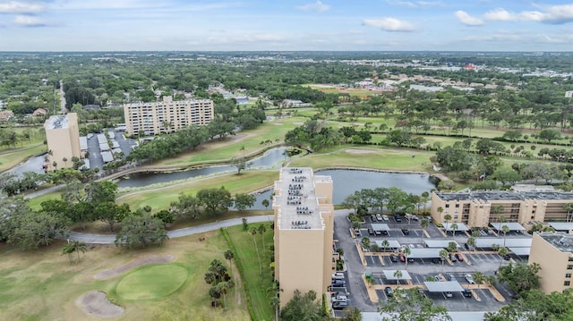 drone / aerial view featuring a water view and golf course view