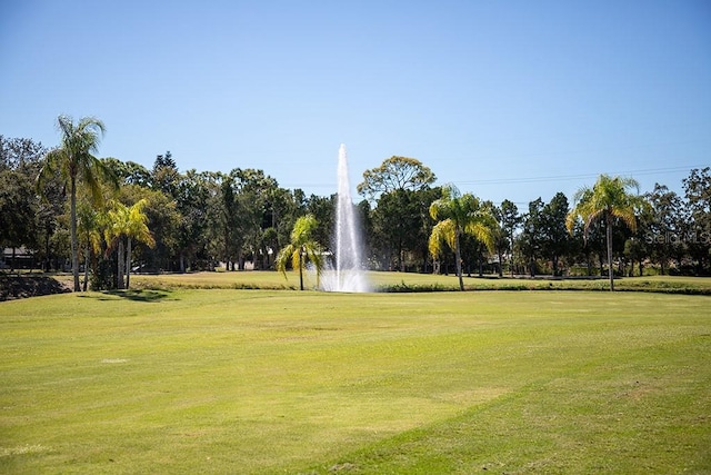 surrounding community with a yard