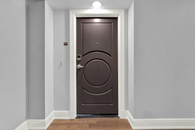 1238 E Kennedy Blvd Unit 702, Tampa, FL 33602 - doorway with wood finished floors and baseboards