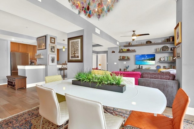 1238 E Kennedy Blvd Unit 702, Tampa, FL 33602 - dining area with wood finished floors and ceiling fan
