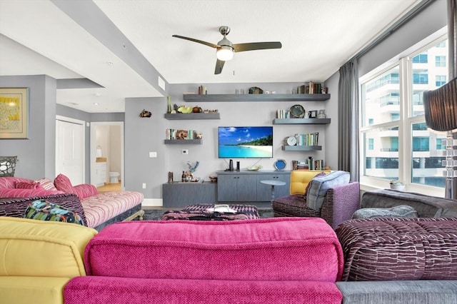 1238 E Kennedy Blvd Unit 702, Tampa, FL 33602 - living area with a ceiling fan and baseboards
