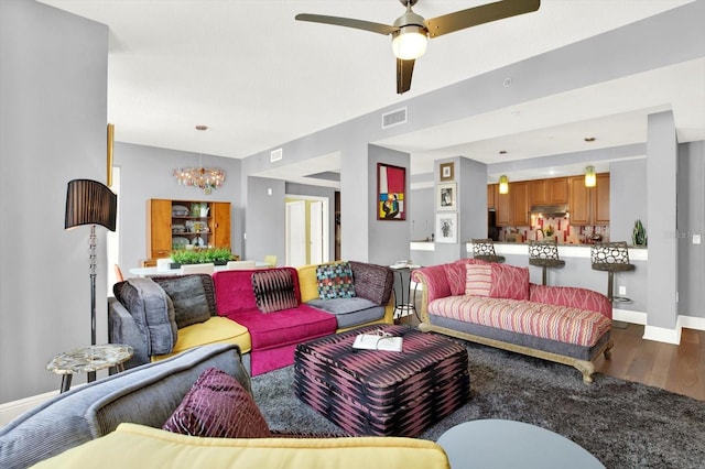 1238 E Kennedy Blvd Unit 702, Tampa, FL 33602 - living room with wood finished floors, a chandelier, ceiling fan, and baseboards