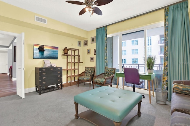 1238 E Kennedy Blvd Unit 702, Tampa, FL 33602 - carpeted living area featuring a ceiling fan and baseboards