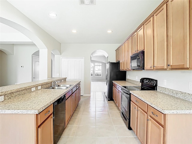 1705 Plantation Pointe Dr, Orlando, FL 32824 - kitchen featuring black appliances, arched walkways, light countertops, light tile patterned floors, and recessed lighting