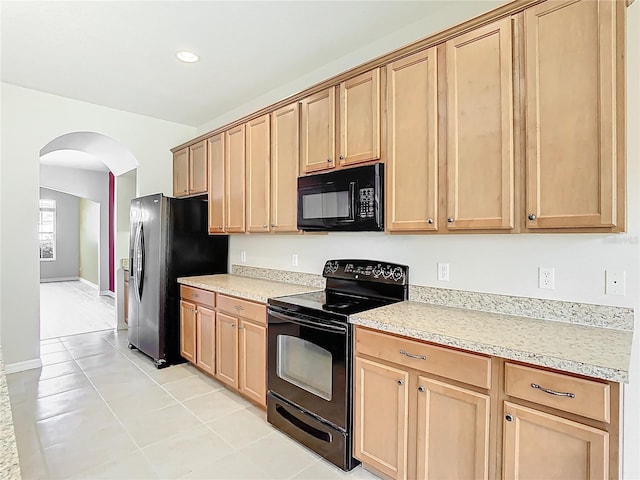1705 Plantation Pointe Dr, Orlando, FL 32824 - kitchen with black appliances, arched walkways, light countertops, light tile patterned floors, and recessed lighting