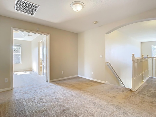 1705 Plantation Pointe Dr, Orlando, FL 32824 - carpeted empty room with arched walkways and a smoke detector