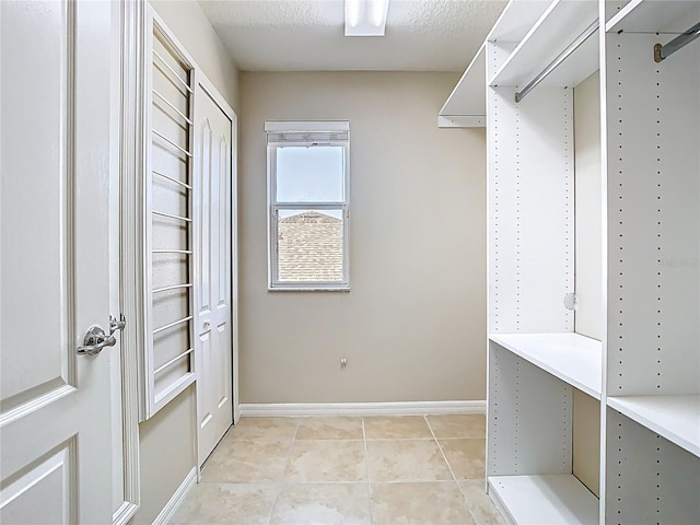 1705 Plantation Pointe Dr, Orlando, FL 32824 - spacious closet with light tile patterned floors