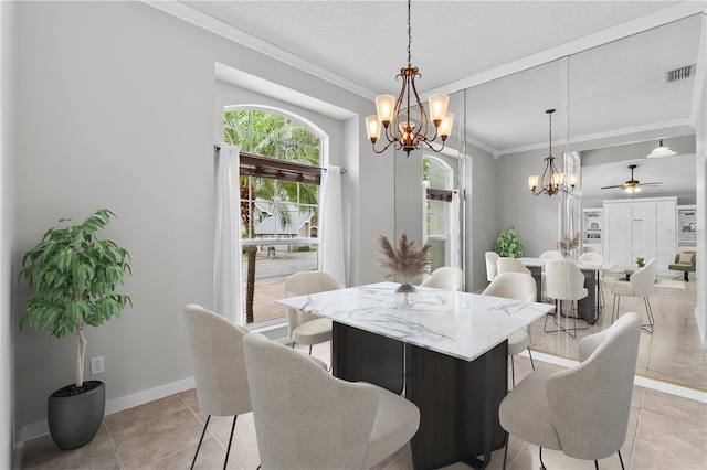 dining area featuring crown molding, a wealth of natural light, ceiling fan with notable chandelier, and visible vents