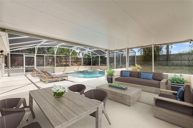 exterior space with a fenced backyard, outdoor lounge area, and a patio area
