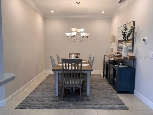 dining space featuring baseboards, an inviting chandelier, ornamental molding, and light tile patterned floors