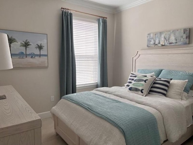 bedroom featuring baseboards and ornamental molding