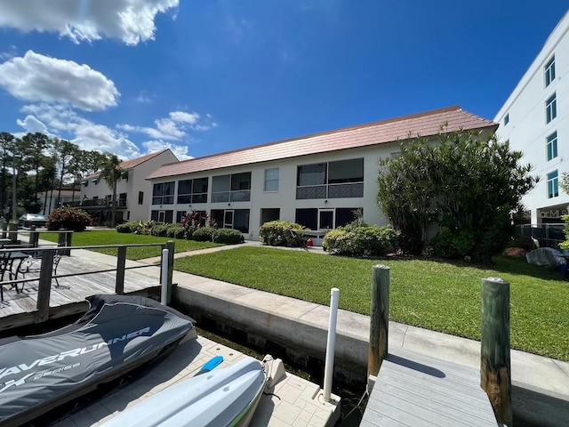 333 Island Way Unit 203, Clearwater Beach, FL 33767 - dock area featuring a yard