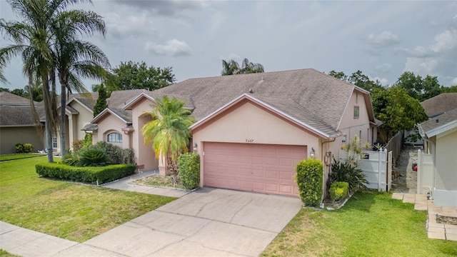 view of front of property featuring a garage, stucco siding, and concrete driveway