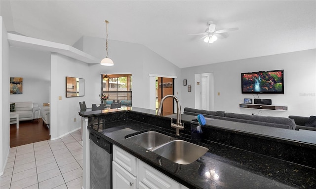 kitchen with dishwasher, vaulted ceiling, a sink, open floor plan, and ceiling fan