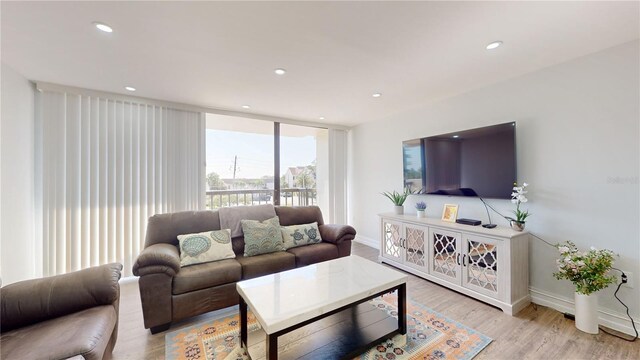 400 Island Way Unit 210, Clearwater Beach, FL 33767 - living area featuring light wood finished floors, baseboards, and recessed lighting