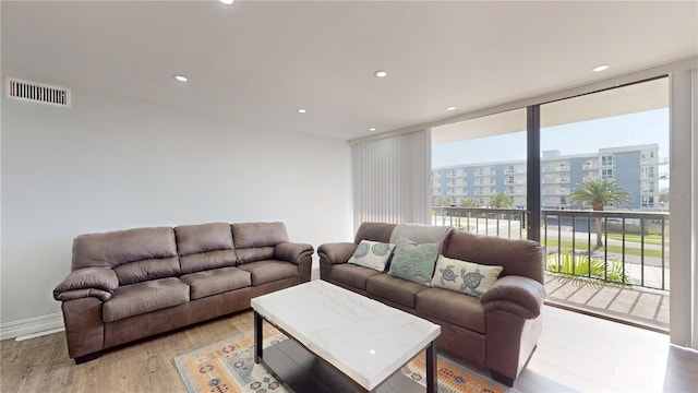 400 Island Way Unit 210, Clearwater Beach, FL 33767 - living area with wood finished floors, recessed lighting, and a view of city