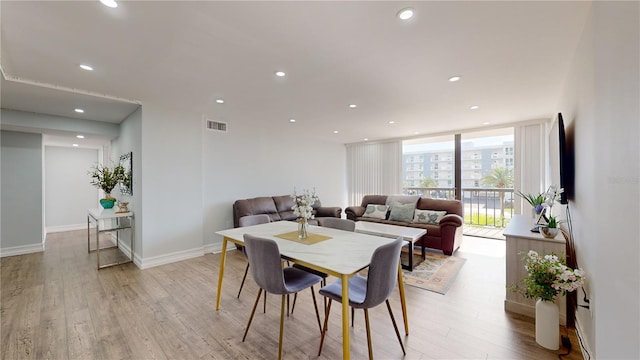 400 Island Way Unit 210, Clearwater Beach, FL 33767 - dining area featuring light wood-type flooring, recessed lighting, and baseboards
