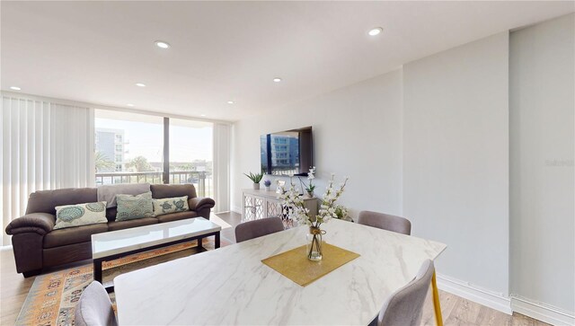 400 Island Way Unit 210, Clearwater Beach, FL 33767 - dining room featuring light wood-style floors, baseboards, and recessed lighting