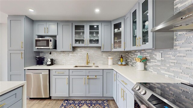 400 Island Way Unit 210, Clearwater Beach, FL 33767 - kitchen featuring a sink, appliances with stainless steel finishes, gray cabinetry, and recessed lighting