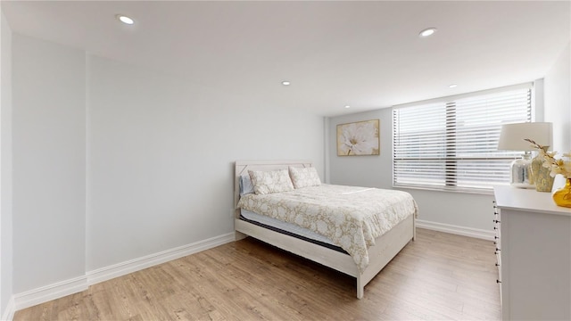 400 Island Way Unit 210, Clearwater Beach, FL 33767 - bedroom with light wood-type flooring, baseboards, and recessed lighting