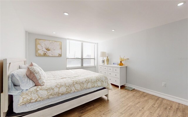 400 Island Way Unit 210, Clearwater Beach, FL 33767 - bedroom featuring light wood finished floors, recessed lighting, and baseboards
