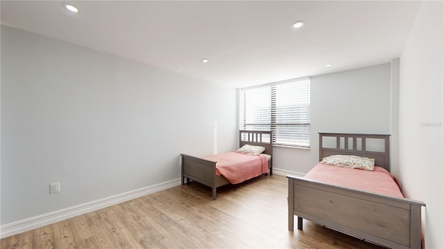 400 Island Way Unit 210, Clearwater Beach, FL 33767 - bedroom with light wood finished floors, recessed lighting, and baseboards