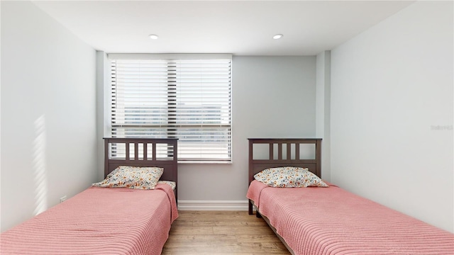 400 Island Way Unit 210, Clearwater Beach, FL 33767 - bedroom featuring wood finished floors, baseboards, and recessed lighting