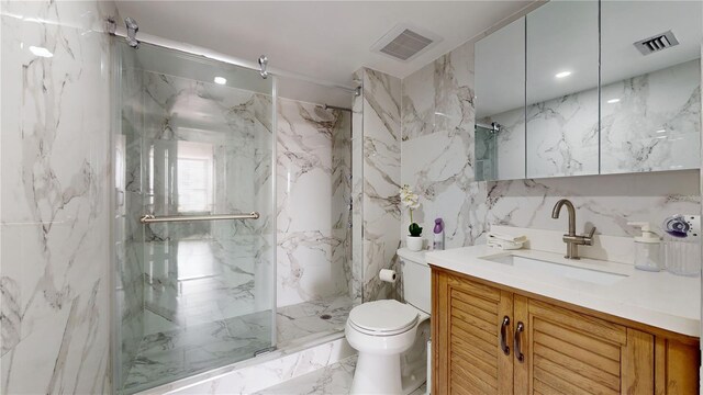 400 Island Way Unit 210, Clearwater Beach, FL 33767 - full bath featuring marble tiled floors, a marble finish shower, toilet, and vanity