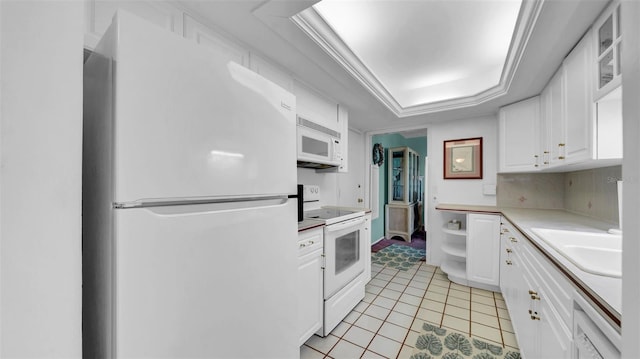 17400 Gulf Blvd Unit I4, North Redington Beach, FL 33708 - kitchen with white cabinetry, a sink, white appliances, and light tile patterned floors