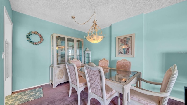 17400 Gulf Blvd Unit I4, North Redington Beach, FL 33708 - dining room featuring baseboards, carpet, and a textured ceiling