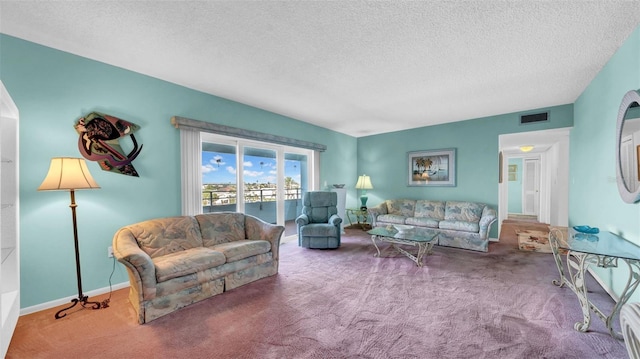 17400 Gulf Blvd Unit I4, North Redington Beach, FL 33708 - living room featuring baseboards, visible vents, carpet floors, and a textured ceiling