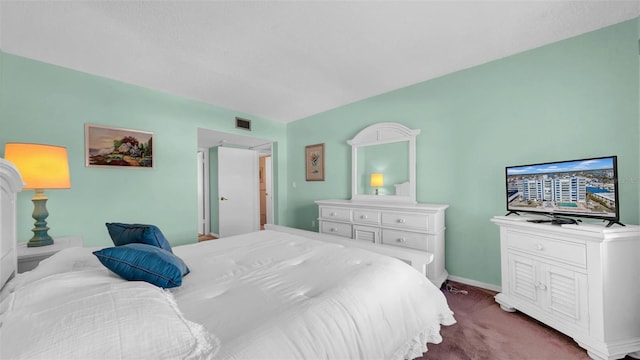 17400 Gulf Blvd Unit I4, North Redington Beach, FL 33708 - bedroom with dark carpet, baseboards, and visible vents