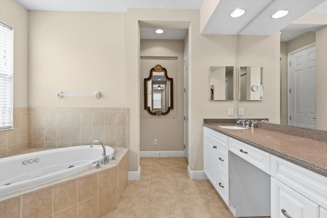 bathroom with vanity, a bath, plenty of natural light, and tile patterned floors