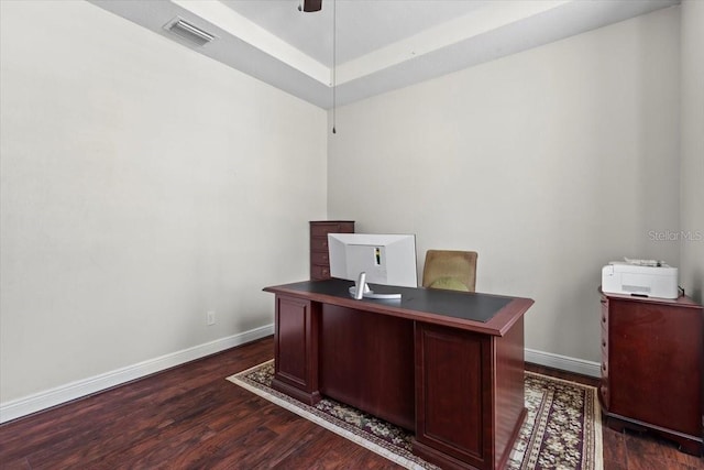 office area with visible vents, baseboards, a ceiling fan, and dark wood-style floors